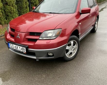 Красный Мицубиси Аутлендер, объемом двигателя 2.4 л и пробегом 293 тыс. км за 3408 $, фото 1 на Automoto.ua