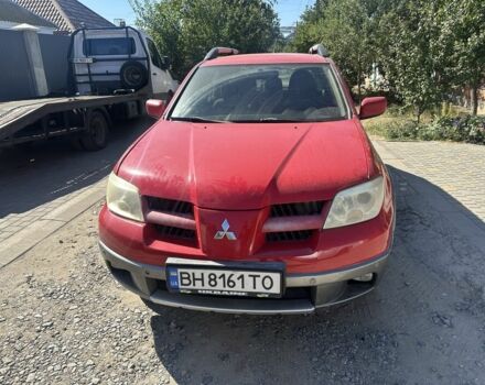 Червоний Міцубісі Аутлендер, об'ємом двигуна 2.4 л та пробігом 235 тис. км за 3999 $, фото 1 на Automoto.ua