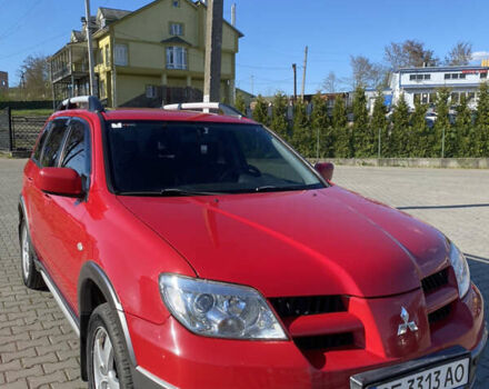 Червоний Міцубісі Аутлендер, об'ємом двигуна 2.4 л та пробігом 111 тис. км за 7500 $, фото 1 на Automoto.ua