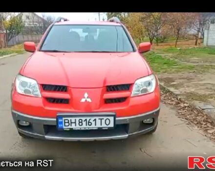 Червоний Міцубісі Аутлендер, об'ємом двигуна 2.4 л та пробігом 234 тис. км за 6800 $, фото 1 на Automoto.ua