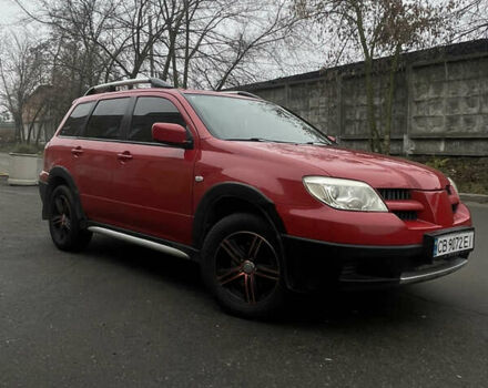 Червоний Міцубісі Аутлендер, об'ємом двигуна 2.4 л та пробігом 224 тис. км за 5600 $, фото 1 на Automoto.ua