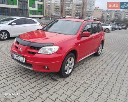 Красный Мицубиси Аутлендер, объемом двигателя 2.4 л и пробегом 269 тыс. км за 5700 $, фото 1 на Automoto.ua