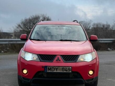 Красный Мицубиси Аутлендер, объемом двигателя 2 л и пробегом 290 тыс. км за 5200 $, фото 1 на Automoto.ua