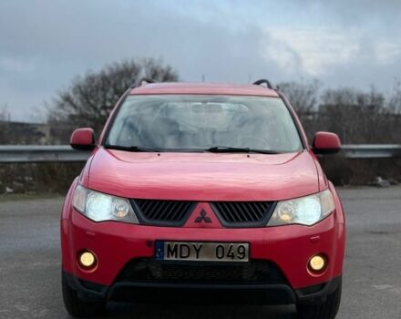 Красный Мицубиси Аутлендер, объемом двигателя 2 л и пробегом 290 тыс. км за 5200 $, фото 1 на Automoto.ua