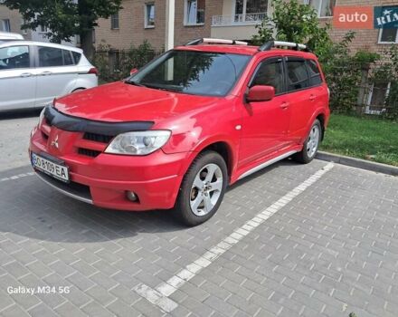 Червоний Міцубісі Аутлендер, об'ємом двигуна 2.4 л та пробігом 265 тис. км за 5300 $, фото 1 на Automoto.ua