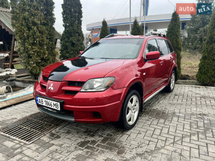 Червоний Міцубісі Аутлендер, об'ємом двигуна 2.4 л та пробігом 187 тис. км за 5600 $, фото 1 на Automoto.ua