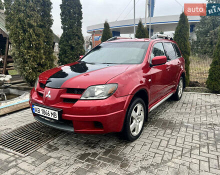 Червоний Міцубісі Аутлендер, об'ємом двигуна 2.4 л та пробігом 187 тис. км за 5600 $, фото 1 на Automoto.ua