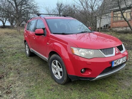 Красный Мицубиси Аутлендер, объемом двигателя 2 л и пробегом 290 тыс. км за 4700 $, фото 1 на Automoto.ua