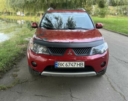 Красный Мицубиси Аутлендер, объемом двигателя 3 л и пробегом 310 тыс. км за 10200 $, фото 1 на Automoto.ua