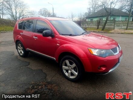 Красный Мицубиси Аутлендер, объемом двигателя 3 л и пробегом 205 тыс. км за 9000 $, фото 1 на Automoto.ua