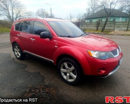 Красный Мицубиси Аутлендер, объемом двигателя 3 л и пробегом 205 тыс. км за 9000 $, фото 1 на Automoto.ua