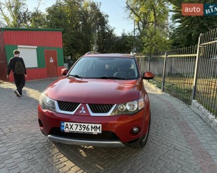 Красный Мицубиси Аутлендер, объемом двигателя 2.36 л и пробегом 143 тыс. км за 8500 $, фото 1 на Automoto.ua