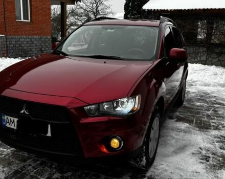 Красный Мицубиси Аутлендер, объемом двигателя 2.4 л и пробегом 190 тыс. км за 8499 $, фото 1 на Automoto.ua