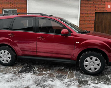 Красный Мицубиси Аутлендер, объемом двигателя 2.36 л и пробегом 260 тыс. км за 8499 $, фото 1 на Automoto.ua