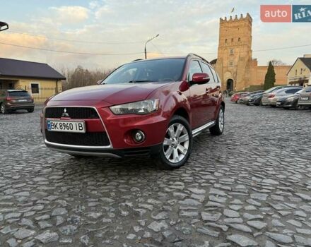 Красный Мицубиси Аутлендер, объемом двигателя 2.36 л и пробегом 134 тыс. км за 10600 $, фото 1 на Automoto.ua