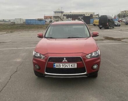 Красный Мицубиси Аутлендер, объемом двигателя 2.36 л и пробегом 210 тыс. км за 11800 $, фото 1 на Automoto.ua