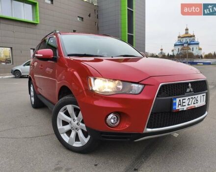 Красный Мицубиси Аутлендер, объемом двигателя 2.36 л и пробегом 93 тыс. км за 11499 $, фото 1 на Automoto.ua