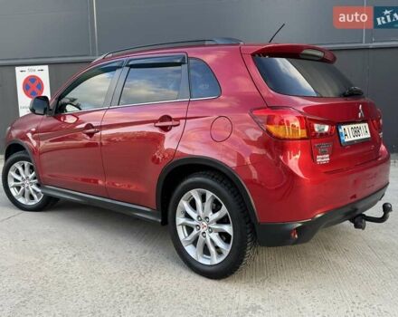 Красный Мицубиси Аутлендер, объемом двигателя 2 л и пробегом 96 тыс. км за 10950 $, фото 1 на Automoto.ua
