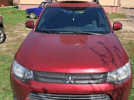 Красный Мицубиси Аутлендер, объемом двигателя 2.4 л и пробегом 80 тыс. км за 9000 $, фото 1 на Automoto.ua