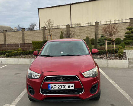 Красный Мицубиси Аутлендер, объемом двигателя 2 л и пробегом 193 тыс. км за 10700 $, фото 1 на Automoto.ua