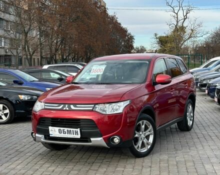 Красный Мицубиси Аутлендер, объемом двигателя 2.4 л и пробегом 213 тыс. км за 11900 $, фото 1 на Automoto.ua