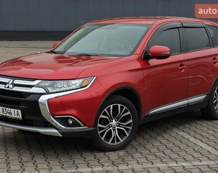 Красный Мицубиси Аутлендер, объемом двигателя 2.36 л и пробегом 123 тыс. км за 15300 $, фото 1 на Automoto.ua