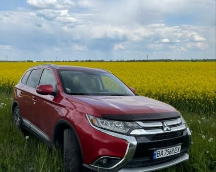Красный Мицубиси Аутлендер, объемом двигателя 3 л и пробегом 58 тыс. км за 19000 $, фото 1 на Automoto.ua