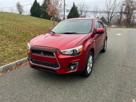 Червоний Міцубісі Аутлендер, об'ємом двигуна 2 л та пробігом 75 тис. км за 9000 $, фото 1 на Automoto.ua