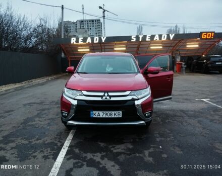 Красный Мицубиси Аутлендер, объемом двигателя 2.4 л и пробегом 117 тыс. км за 14000 $, фото 1 на Automoto.ua