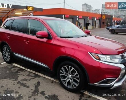 Красный Мицубиси Аутлендер, объемом двигателя 2.36 л и пробегом 118 тыс. км за 14000 $, фото 1 на Automoto.ua