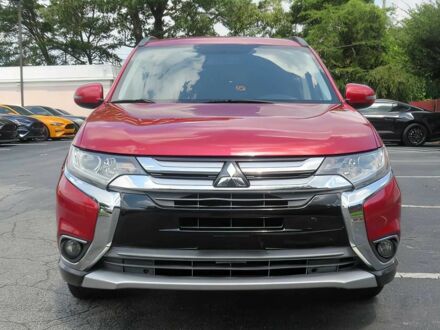 Красный Мицубиси Аутлендер, объемом двигателя 2.4 л и пробегом 70 тыс. км за 6400 $, фото 1 на Automoto.ua