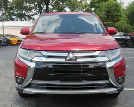 Красный Мицубиси Аутлендер, объемом двигателя 2.4 л и пробегом 70 тыс. км за 6400 $, фото 1 на Automoto.ua