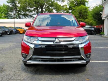 Красный Мицубиси Аутлендер, объемом двигателя 2.4 л и пробегом 70 тыс. км за 2400 $, фото 1 на Automoto.ua