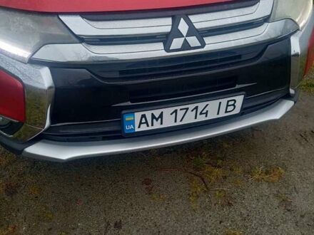 Красный Мицубиси Аутлендер, объемом двигателя 2.36 л и пробегом 131 тыс. км за 16300 $, фото 1 на Automoto.ua