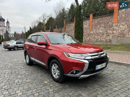 Красный Мицубиси Аутлендер, объемом двигателя 2.4 л и пробегом 225 тыс. км за 11900 $, фото 1 на Automoto.ua