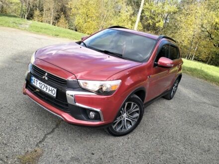 Красный Мицубиси Аутлендер, объемом двигателя 2.4 л и пробегом 185 тыс. км за 12200 $, фото 1 на Automoto.ua