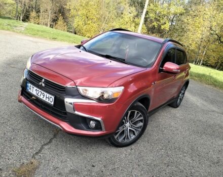 Красный Мицубиси Аутлендер, объемом двигателя 2.4 л и пробегом 185 тыс. км за 12200 $, фото 1 на Automoto.ua