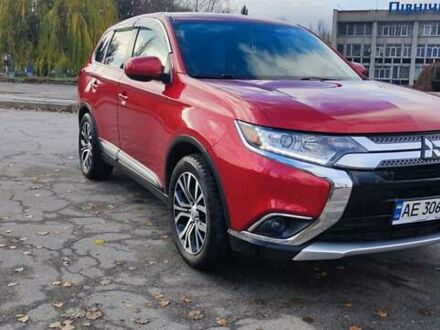 Красный Мицубиси Аутлендер, объемом двигателя 2.36 л и пробегом 80 тыс. км за 16500 $, фото 1 на Automoto.ua