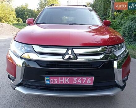 Красный Мицубиси Аутлендер, объемом двигателя 2.4 л и пробегом 235 тыс. км за 12800 $, фото 1 на Automoto.ua