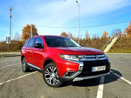 Червоний Міцубісі Аутлендер, об'ємом двигуна 2.4 л та пробігом 174 тис. км за 14300 $, фото 1 на Automoto.ua