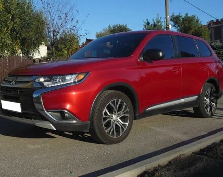 Красный Мицубиси Аутлендер, объемом двигателя 2.4 л и пробегом 117 тыс. км за 10500 $, фото 1 на Automoto.ua