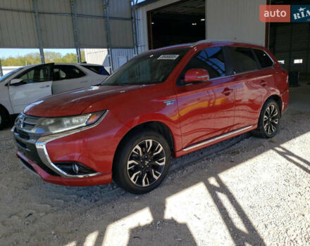 Красный Мицубиси Аутлендер, объемом двигателя 2 л и пробегом 226 тыс. км за 12500 $, фото 1 на Automoto.ua