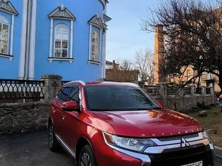 Красный Мицубиси Аутлендер, объемом двигателя 2.4 л и пробегом 125 тыс. км за 17400 $, фото 1 на Automoto.ua