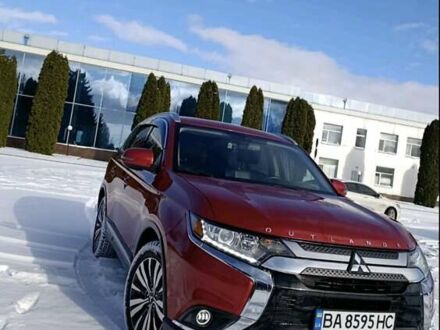 Красный Мицубиси Аутлендер, объемом двигателя 2.36 л и пробегом 120 тыс. км за 16800 $, фото 1 на Automoto.ua