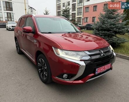 Красный Мицубиси Аутлендер, объемом двигателя 2 л и пробегом 176 тыс. км за 18900 $, фото 1 на Automoto.ua