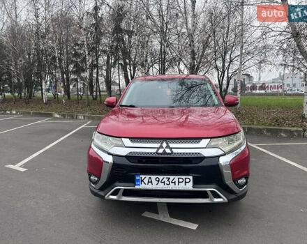 Красный Мицубиси Аутлендер, объемом двигателя 2.36 л и пробегом 148 тыс. км за 16500 $, фото 1 на Automoto.ua