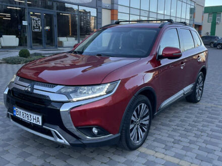 Красный Мицубиси Аутлендер, объемом двигателя 2.36 л и пробегом 100 тыс. км за 16500 $, фото 1 на Automoto.ua
