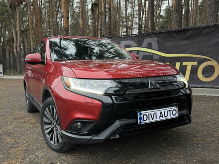 Красный Мицубиси Аутлендер, объемом двигателя 2.4 л и пробегом 197 тыс. км за 18700 $, фото 1 на Automoto.ua