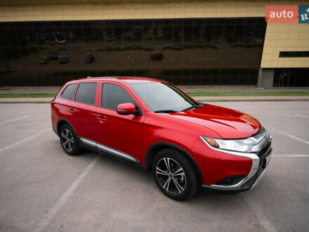 Красный Мицубиси Аутлендер, объемом двигателя 2.36 л и пробегом 145 тыс. км за 17000 $, фото 1 на Automoto.ua