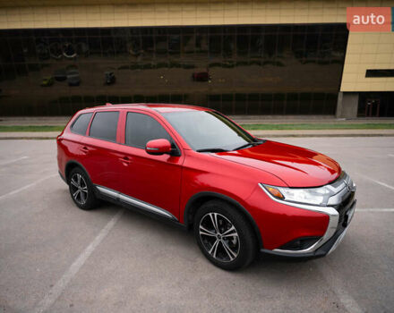 Красный Мицубиси Аутлендер, объемом двигателя 2.36 л и пробегом 145 тыс. км за 17000 $, фото 1 на Automoto.ua